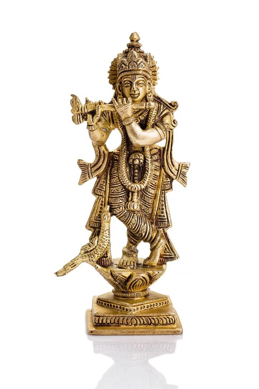 Krishna god Vishnu avatar brass statue isolated on white with reflection