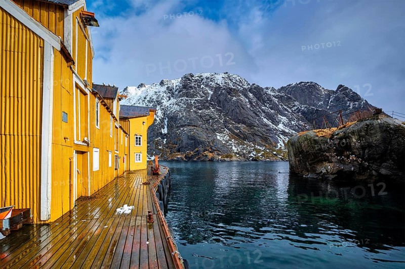 Nusfjord authentic fishing village in winter with red rorbu houses. Lofoten islands