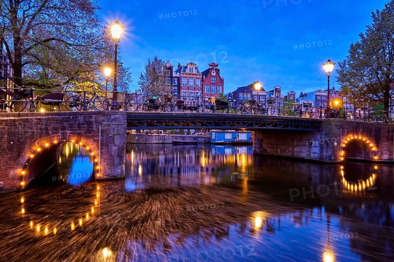 Night view of Amterdam cityscape with canal