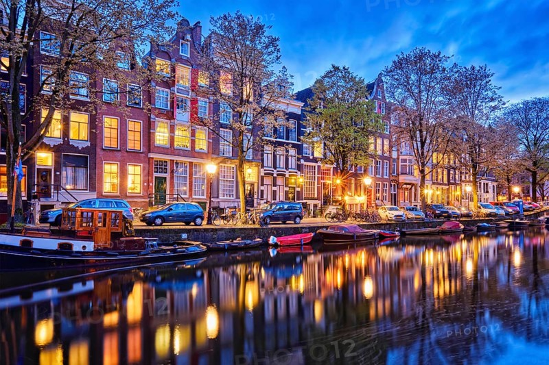 Night view of Amterdam cityscape with canal
