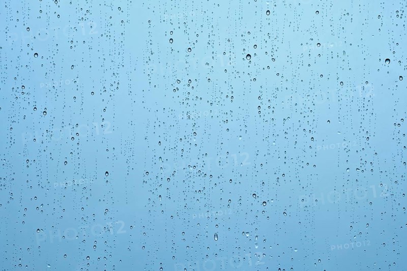 Rain water drops droplets on window glass texture background
