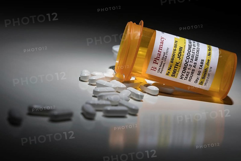 Hydrocodone pills and prescription bottle with non proprietary label. no model release required