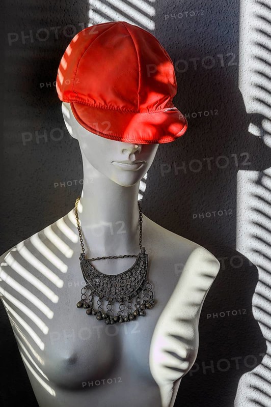 White fashion doll with red baseball cap and oriental silver jewellery