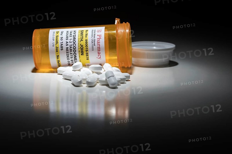 Hydrocodone pills and prescription bottle with non proprietary label. no model release required