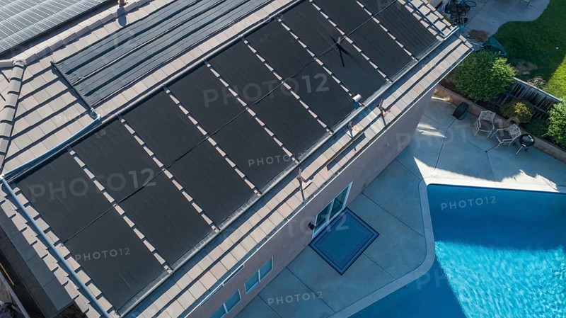 Thermal solar panels installed on the roof of a large house