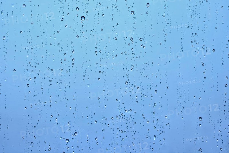 Rain water drops droplets on window glass texture background