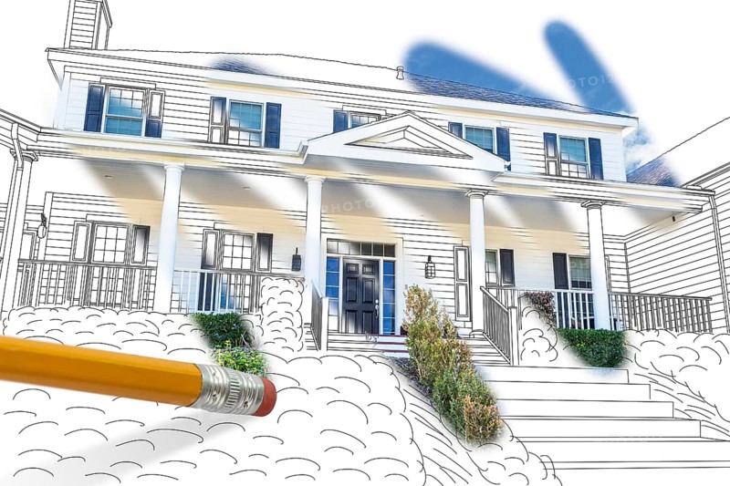 Pencil erasing drawing to reveal finished custom house design photograph