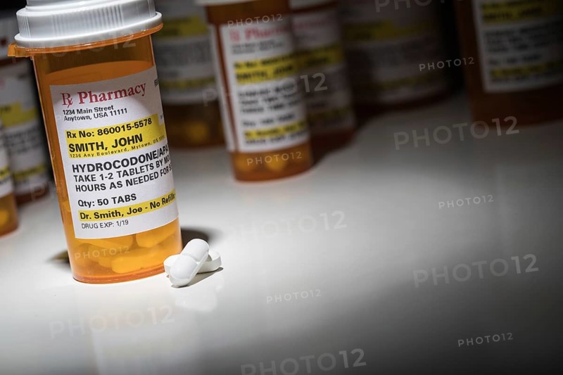 Hydrocodone pills and prescription bottles with non proprietary label. no model release required