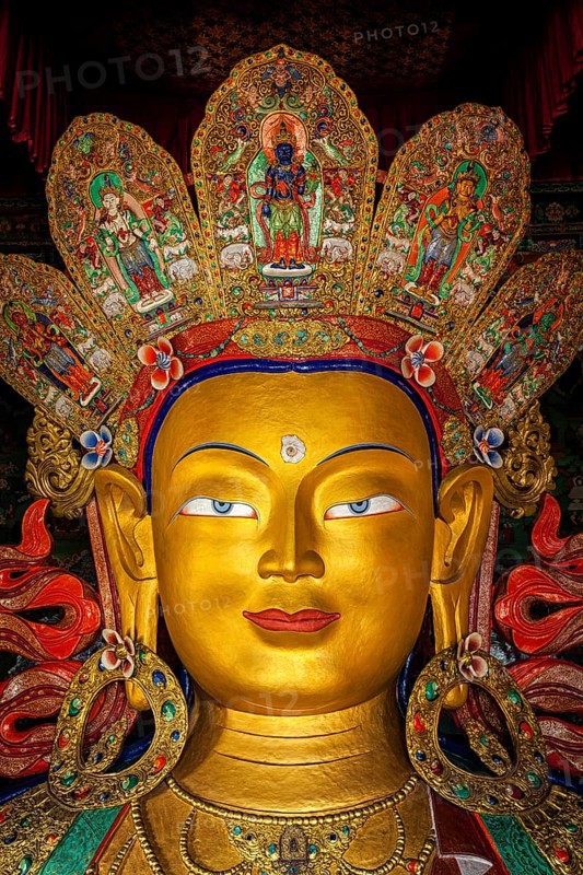 Maitreya Buddha statue face close up in Thiksey Gompa. Ladakh