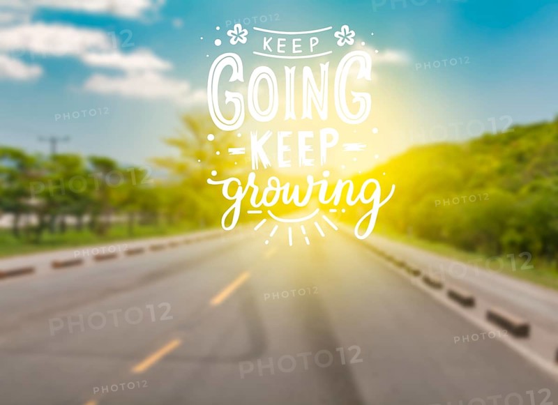 Asphalt road with motivational phrase