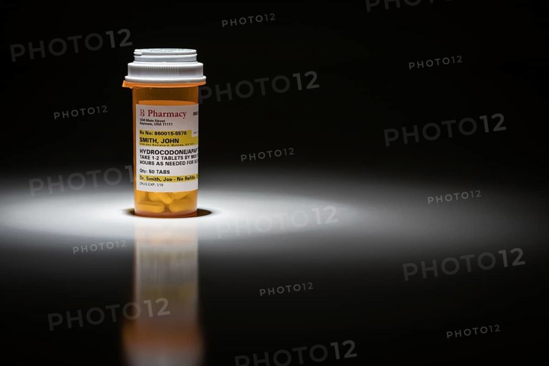 Hydrocodone pills and prescription bottle with non proprietary label. no model release required