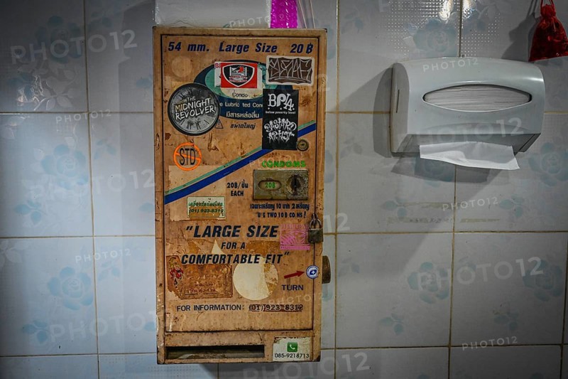 Condom vending machine in toilet in Beer Garden