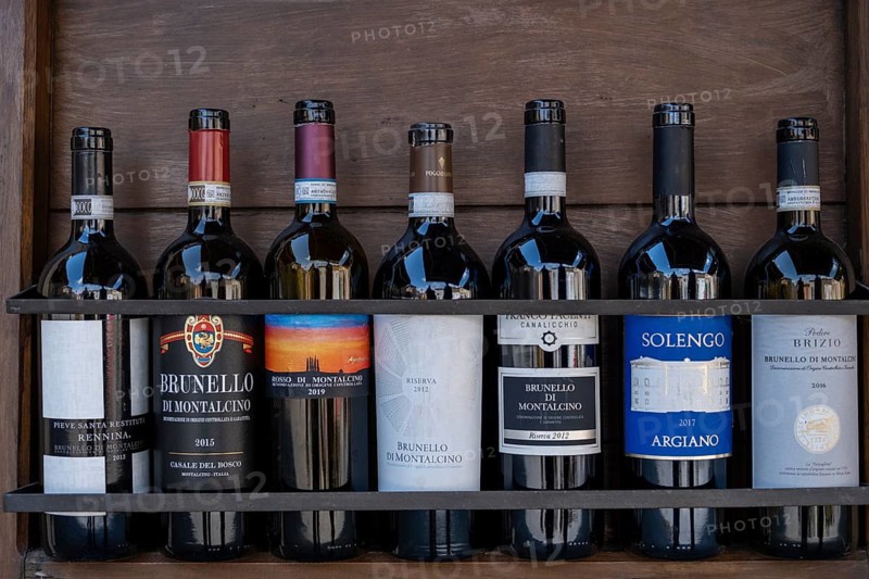 Wine bottles standing on shelf