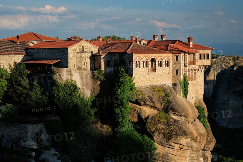 Monastery of Varlaam monastery in famous greek tourist destination Meteora in Greece on sunset with scenic scenery landscape