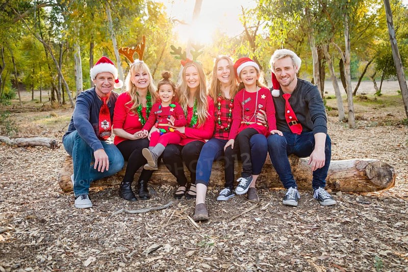 Christmas themed multiethnic family portrait outdoors