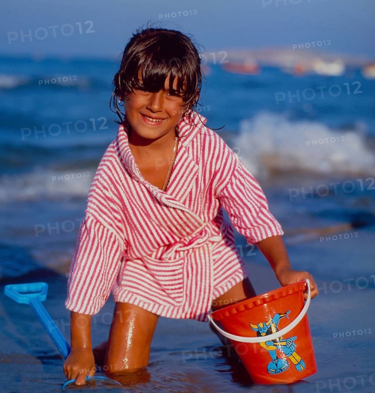 Child on the beach bucket and shovel