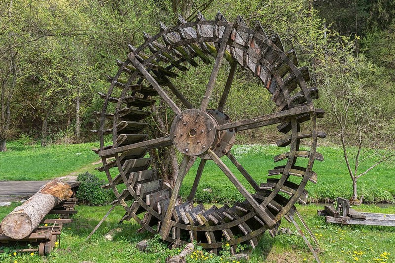Disused mill wheel set up as decoration at a mill