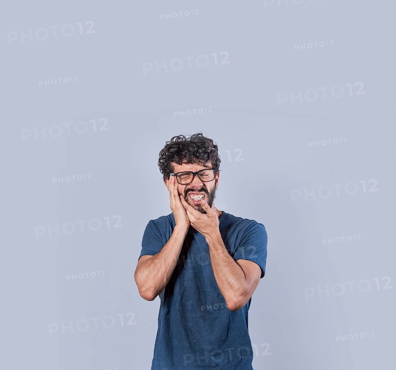 Attractive boy with toothache