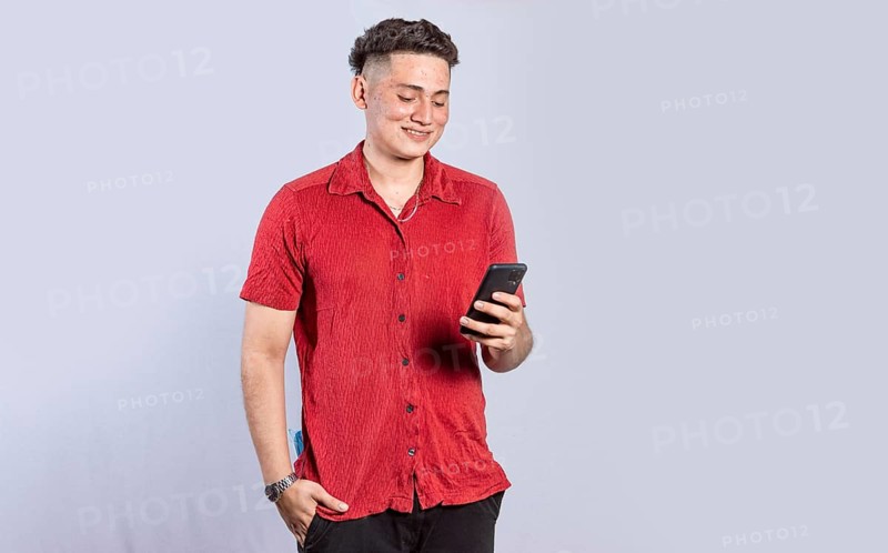Handsome guy happy with his cell phone