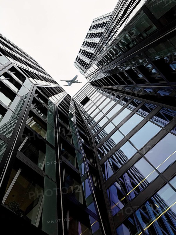 Aeroplane over two skyscrapers