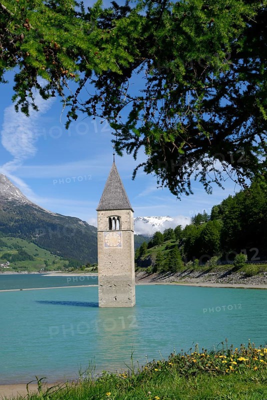 Old church spire of Graun in Reschensee