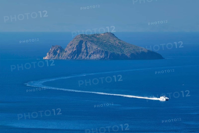 Speeding speed boat catamaran ferry vessel in Aegean sea near Milos island on summer day in Greece