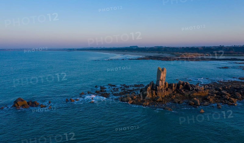Aerial view of rock formations in the sea in front of the sandy beach Ker Emma