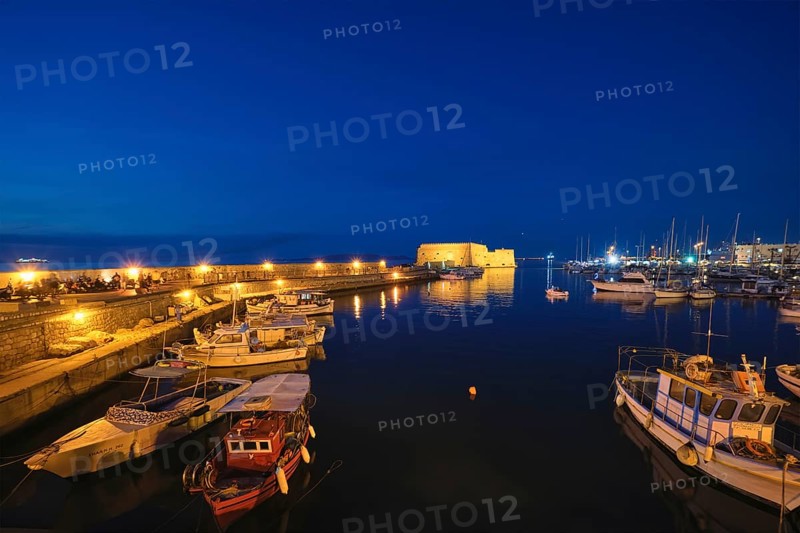 Venetian Fort Venetian fortress of Koules Castello a Mare castle in Heraklion and moored Greek fishing boats in port