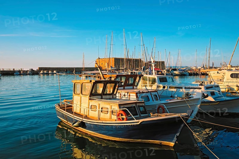 Venetian Fort Venetian fortress of Koules Castello a Mare castle in Heraklion and moored Greek fishing boats in port