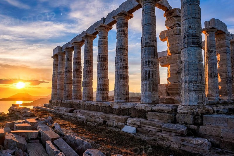 Cape Sounio sunset at Sounion with ruins of the iconic Poseidon temple