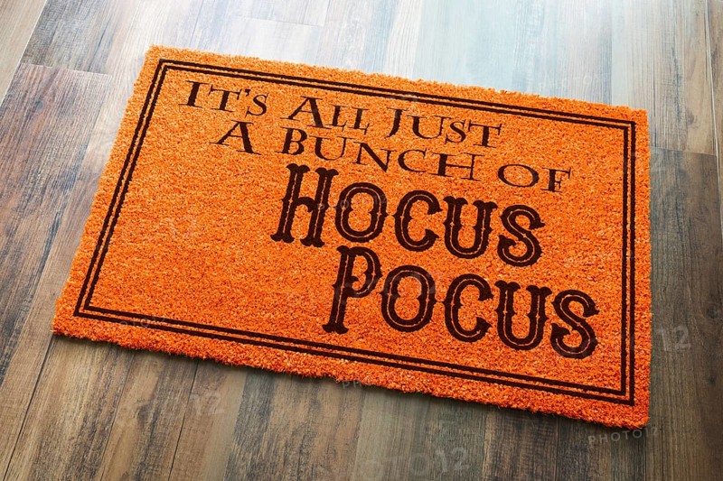 It's all A bunch of hocus pocus halloween orange welcome mat on wood floor background