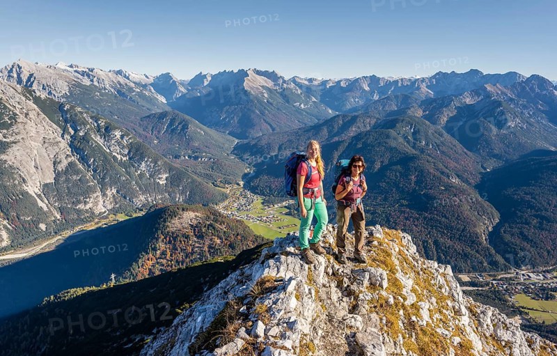 Two female hikers on a summit