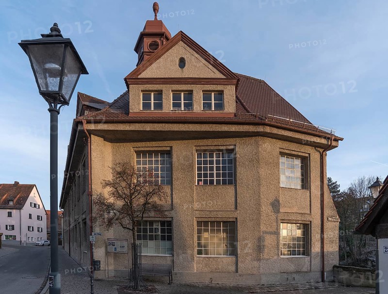 Historic main building of a former valve factory in the evening light
