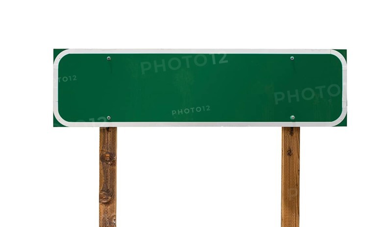 Blank green road sign with wooden posts isolated on a white background