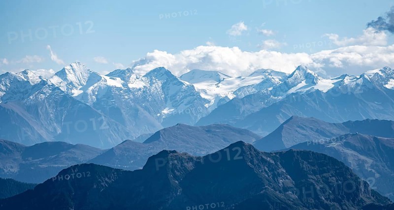 Snow-covered mountain peaks on the main ridge of the Alps