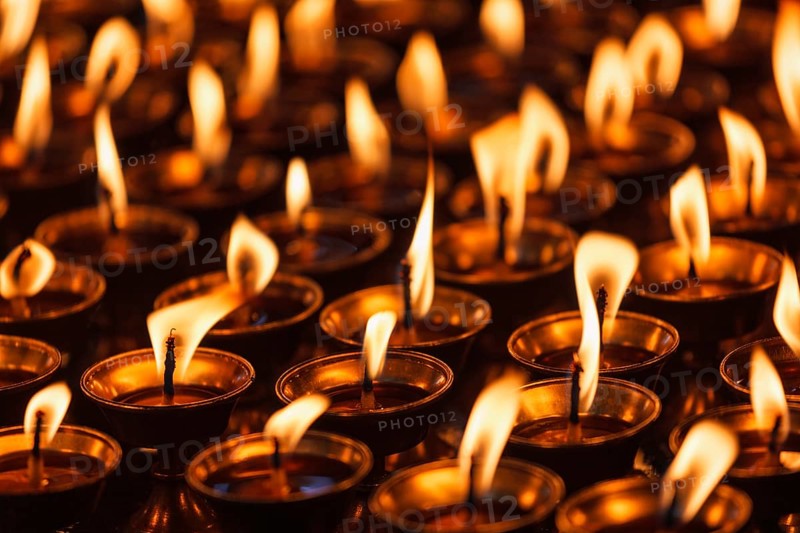 Burning candles in Buddhist temple