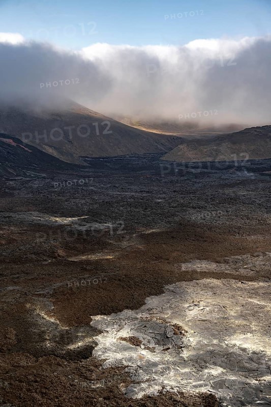 Lava fields with sulphur deposits between hills