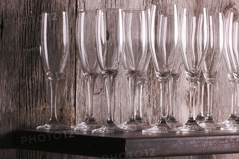 Champagne flutes on shelf abstract