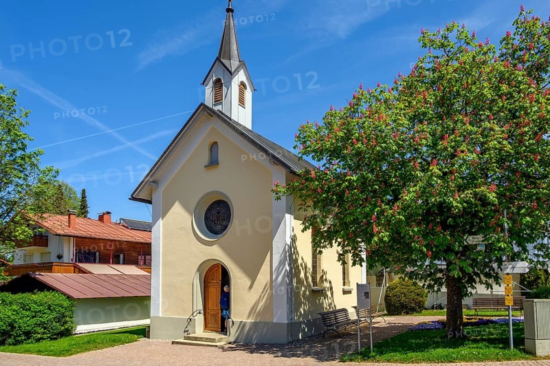 Lourdes Chapel from 1895 and red flowering horse-chestnut