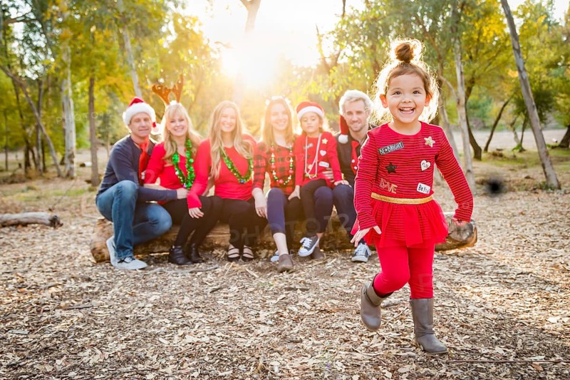 Christmas themed multiethnic family portrait outdoors