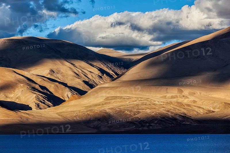 Himalayas and Himalayan mountain lake Tso Moriri on sunset. Korzok
