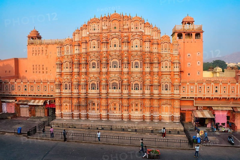 Famous landmak pink Hawa Mahal Palace of winds with people