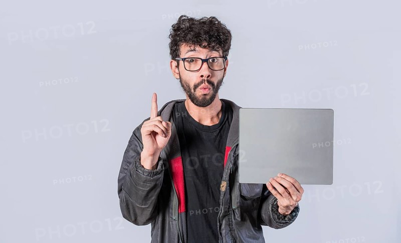 Young man holding poster