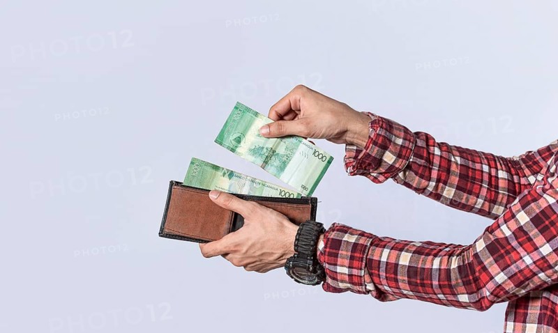Man taking money out of his wallet