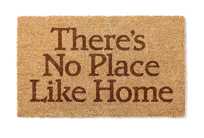 There is no place like home welcome mat isolated on A white background