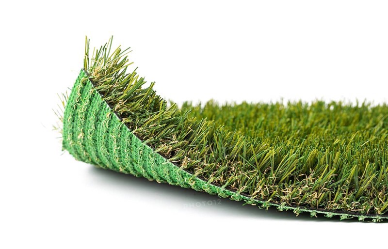 Flipped up section of artificial turf grass on white background