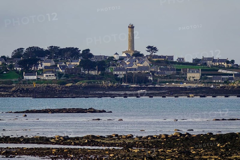 View at low tide from Roscoff to the island Ile de Batz with lighthouse
