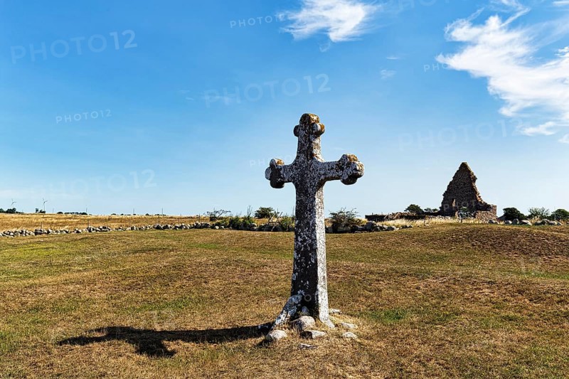 Stone cross in a meadow