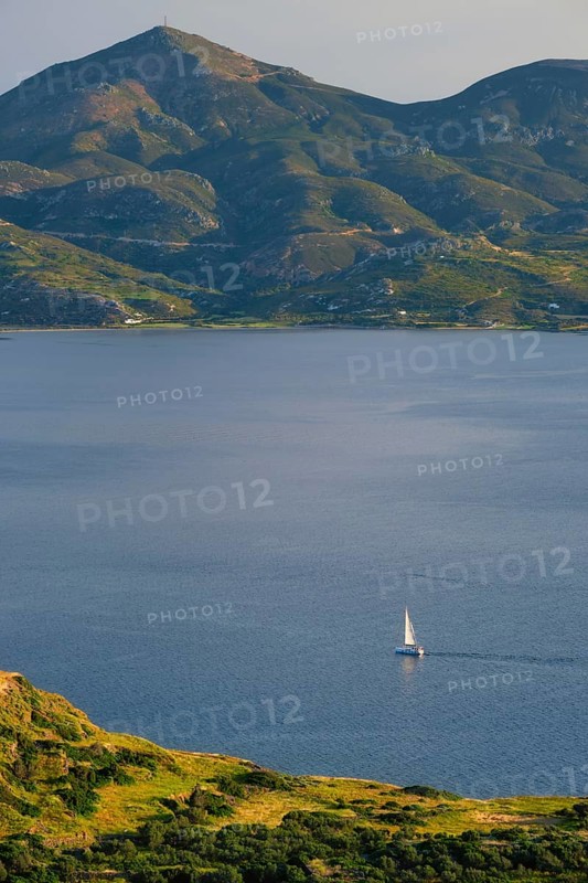 Yacht boat in Aegean sea near Milos island on sunset. Milos island