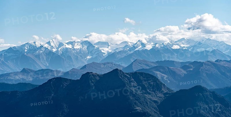Snow-covered mountain peaks on the main ridge of the Alps